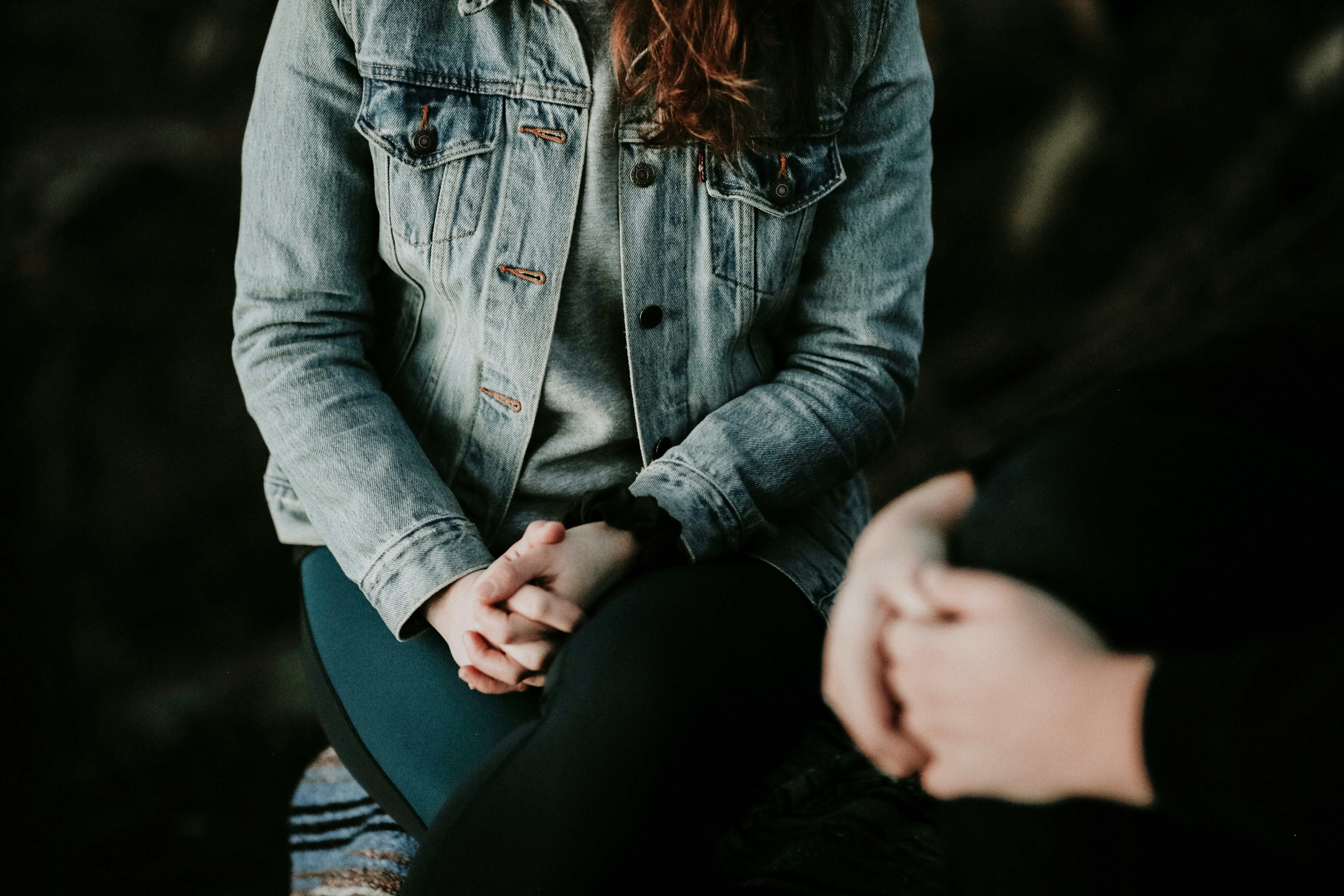 Therapist and client in a warm, supportive conversation